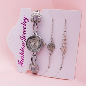 Women's silver quartz watch and bracelet set on fashion jewelry display card
