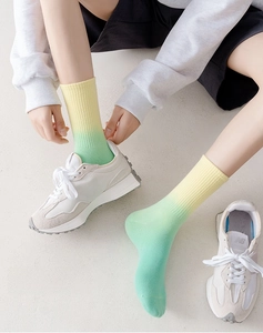 Detail of rib-knit gradient crew socks showing high elasticity and anti-pilling texture