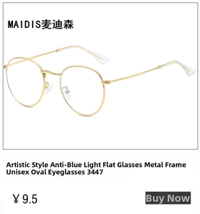 Close-up of golden round metal TR90 eyeglass frame with anti-blue light lenses