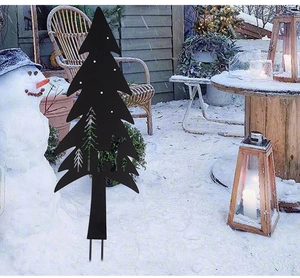 Outdoor Christmas metal garden stake featuring reindeer cutout silhouette in a snowy yard