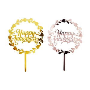 Detail of gold and rose gold acrylic Happy Anniversary cake toppers with wreath design