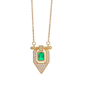 Elegant gold necklace featuring a green rectangular gemstone pendant with crystal halo