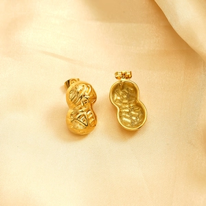 Vintage peanut-shaped stud earrings in 18K gold plated stainless steel on satin fabric