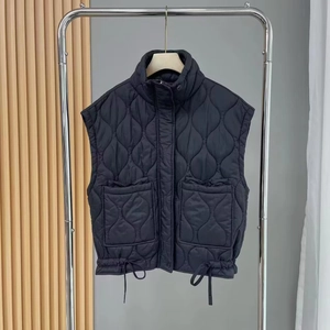 Women's black quilted vest jacket with onion stitching and adjustable drawstring hem