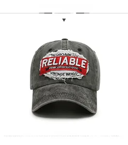 Detailed front view of washed dark grey baseball cap with distressed Reliable embroidery