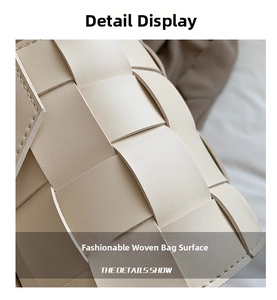 Macro detail of the cream woven leather pattern on this minimalist crossbody bucket bag