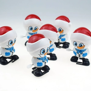 Close-up of a set of 6 wind-up walking snowman toys with red hats and blue scarves