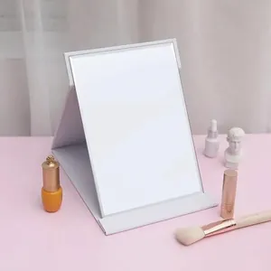 Portable white textured folding makeup mirror for desk with adjustable standing support
