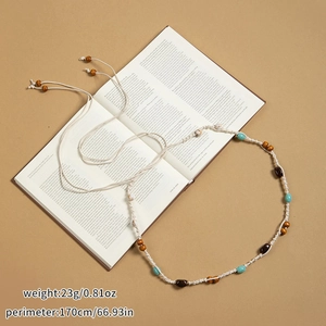 Détail de chaîne de taille bohème en corde de coton crème avec perles turquoise et bois