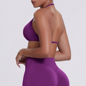 Detail of purple seamless halter sports bra and high waist leggings yoga set