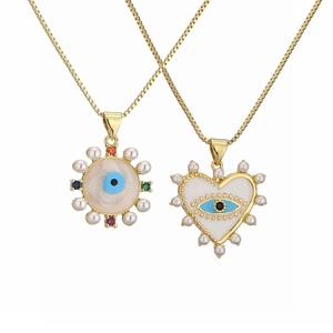 Gold evil eye heart and disc pendant necklace set with pearls and zircons