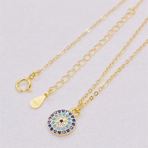 Detailed close-up of S925 sterling silver stamp on the gold-plated evil eye necklace chain