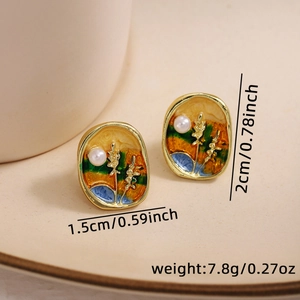 Detailed macro view of vintage enamel earrings with pearl accents and size dimensions