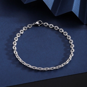 Close-up of textured silver Cuban link chain bracelet with secure lobster clasp for men