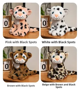 Detail showing plush leopard toys in pink, white, brown and beige colors with blue eyes