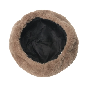 Detailed interior view of plush winter beret with soft faux fur and black lining