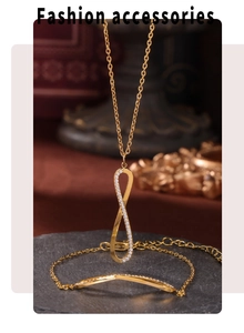 Detailed view of infinity symbol necklace and bracelet set with cubic zirconia inlay