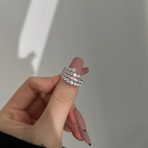 Close-up of a multi-layer S925 silver ring featuring sparkling zircon pavé heart details