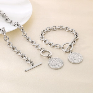 Detailed shot of silver tree of life pendants on link chain with toggle clasps