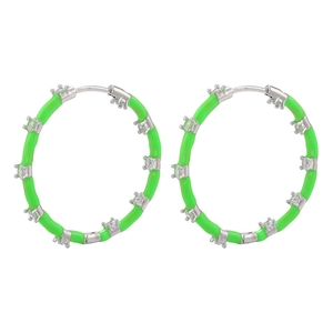 Close-up of green enamel hoop earrings with inlaid clear cubic zirconia crystals