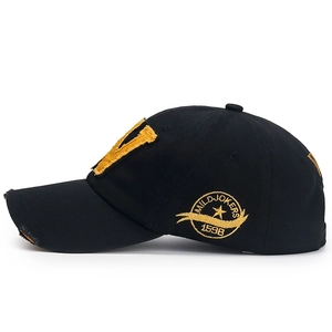 Distressed black baseball cap with yellow letter V patch and vintage embroidery