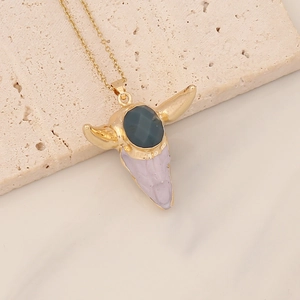 Retro bohemian necklace with golden bull head pendant and teal and purple stones
