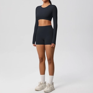 Close-up of black long sleeve yoga top and high-waist shorts set in premium matte fabric