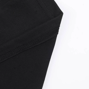 Macro shot of precise stitching and flat seams on premium black dress fabric texture