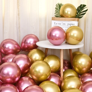 Macro view of metallic rose gold and gold latex balloons with glossy chrome finish