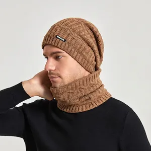 Brown knitted beanie and neck warmer set with warm fleece lining and leather patch detail