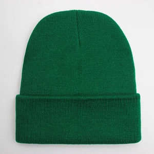 Macro detail of grass green knit beanie showing fine texture and ribbed stitching