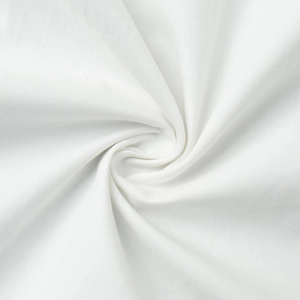 Close-up of premium white cotton fabric showing smooth texture and fine weave detail