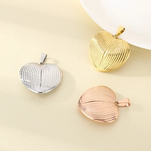 Vertical striped heart pendants in gold, silver, and rose gold stainless steel finishes