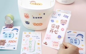 Detail showing cute cartoon PVC stickers decorated on a storage bin with soft lighting