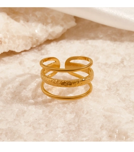Detail of 18K gold-plated triple-layered open ring with hammered texture and smooth finish