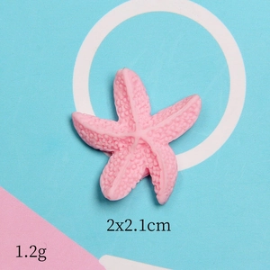 Detail view of pink resin starfish accessory with 2x2.1cm size and matte finish
