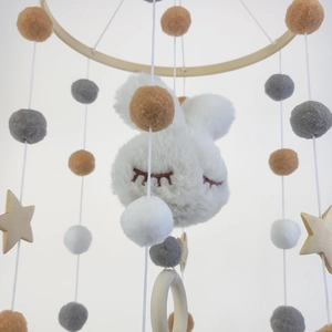 Baby mobile with white plush cloud, wooden stars and felt balls on a bamboo ring