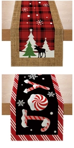 Detail of Christmas table runners with red plaid reindeer and JOY candy cane designs