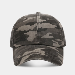 Detail of classic camouflage baseball cap featuring breathable eyelets and curved brim