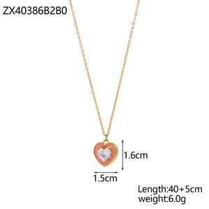 Detail view of heart pendant showing pink frame and sparkling zircon stone