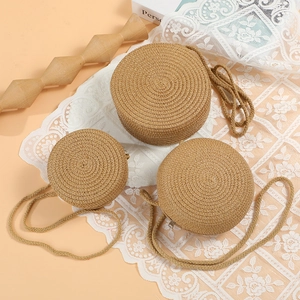 Three sizes of round straw woven shoulder bags in light brown with spiral textures