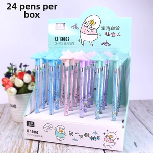 Detail of macaron bullet pencils with cartoon duck prints and hat caps on a desk