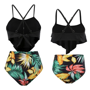 Detail of two-piece tankini with black ruffle top and floral high-waisted bikini bottoms