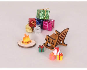 Miniature Christmas set with wooden rocking chair, colorful gift boxes, and a tiny campfire