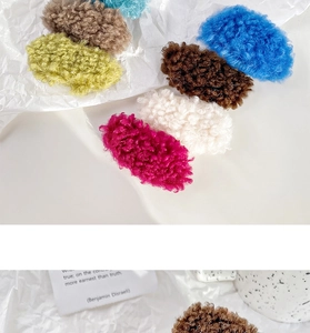 Detailed macro view of soft candy-colored lamb wool hair clips in various vibrant colors