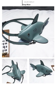 Detailed views of a grey blue shark-shaped crossbody bag with fins and tail accents