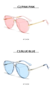Detail view of pink and blue aviator sunglasses with gold metal frames and retro design