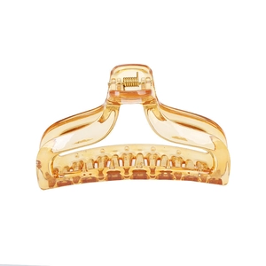 Classic amber resin hair claw clip for women's updos on a clean white background