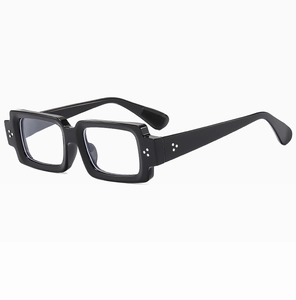 Detail view of thick black square frames with decorative silver triple-dot rivets