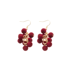 Retro red velvet grape tassel earrings with gold metal hooks on white background
